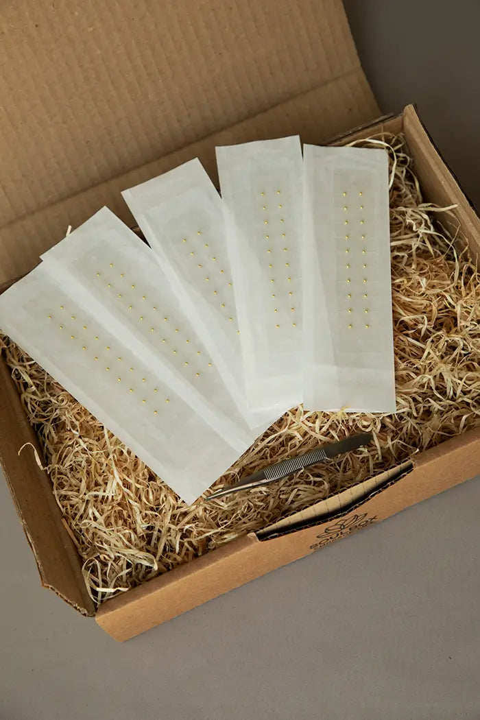 Ørefrø i guld kan bruges mod stress, angst, spændinger, migræne, søvnløshed, overgangsalder, menustrationssmerter mv.